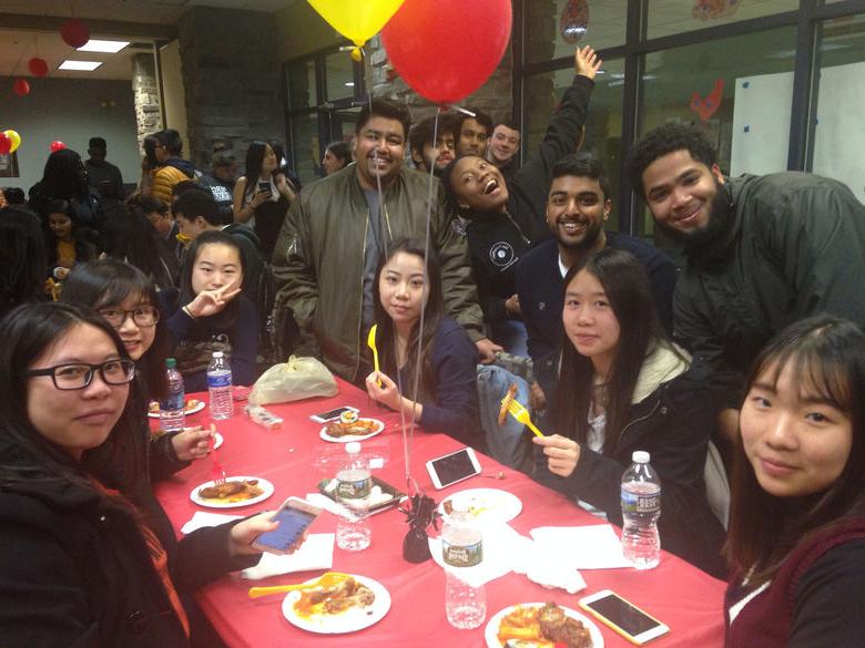 Students smiling for group photo at Lions Gate Event