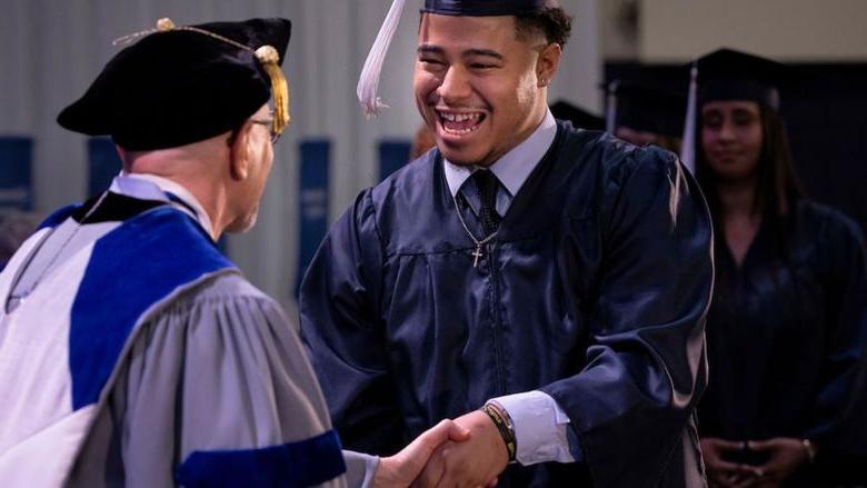 Student receives his college degree