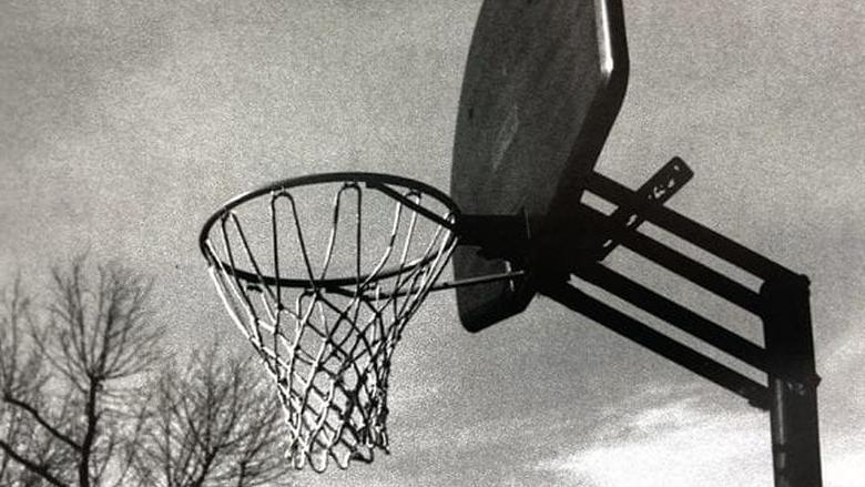 black and white photograph basketball net